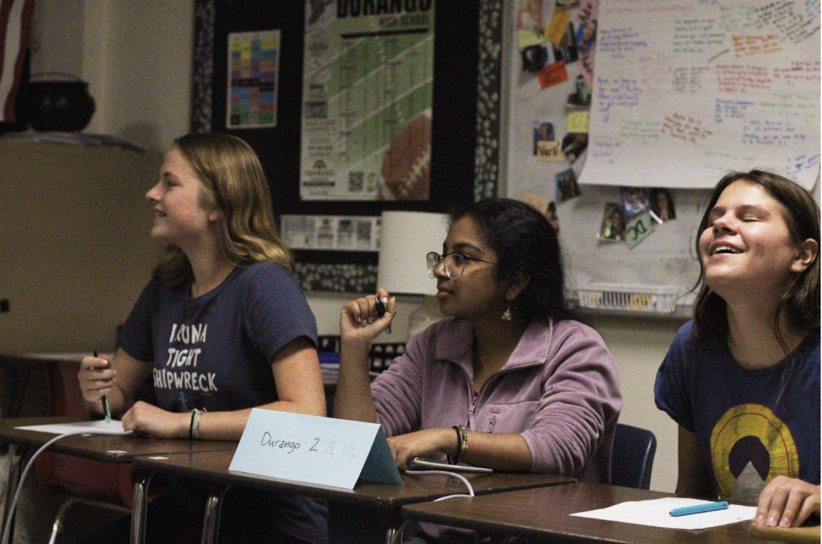 Junior varsity team Larkyn Sarver, Maya Donaldson, and Shreya Vaidya sigh after getting a question incorrect in the final round. After  DHS varsity, JV, and freshmen teams scored the highest in the second round, only DHS students were in room 1 for the final round.
